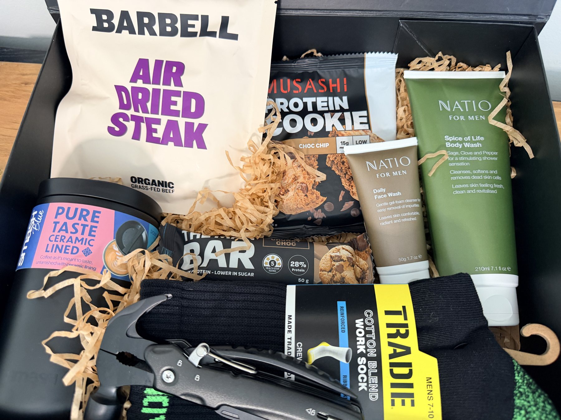 The Worksite Warrior Hamper packed open, showing all the gear inside