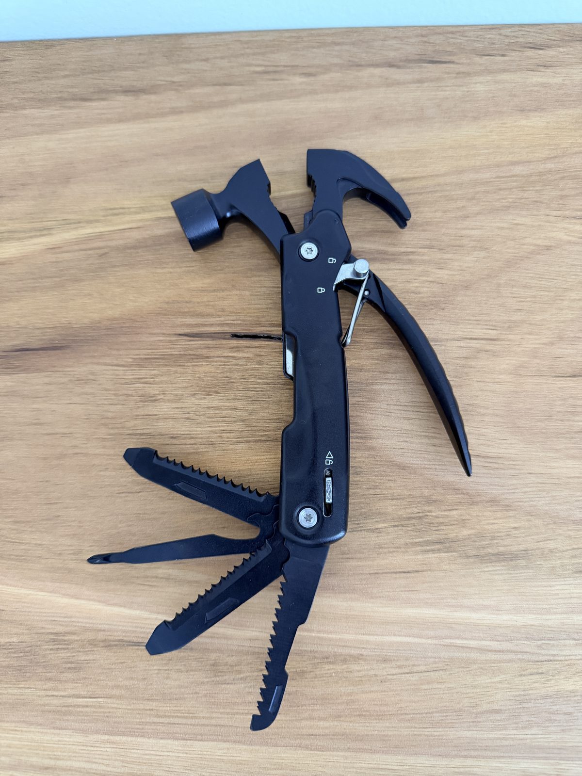 Multi-tool hammer with pliers, screwdriver and knife attachments